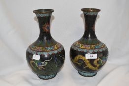 A pair of early 20th century Japanese cloisonne vases decorated with imperial yellow double dragons,