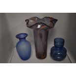 Three modern art glass vases including a large fluted purple and pink steaked vase