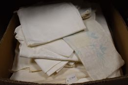 A collection of vintage and antique Damask table cloth and napkins.