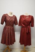 Two vintage dresses in red, including 1950s red and gold brocade dress.