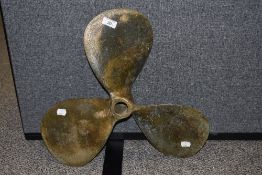 A vintage brass ships propeller marked 98 54A, 44cm wide