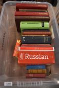 A carton of books in different languages including 'Oxford Mini Study Spanish Dictionary and '