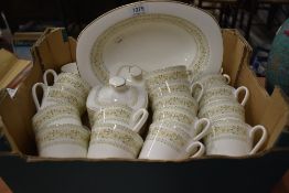 Fifteen Royal Doulton Paisley pattern tea cups with a sugar bowl and serving dish.