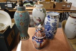 Four oriental vases including Imari urn AF, Famille Rose lamp base, transfer printed blue and