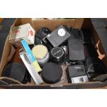 A box of various filters , flashes etc