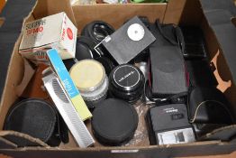 A box of various filters , flashes etc