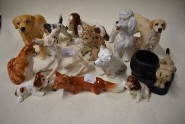 A collection of animal themed figure studies including a Wedgwood deer, Sylvac spaniel and puppies