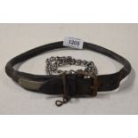 An early 20th century leather dog collar with metal fitments and unmarked name badge