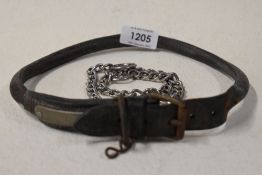 An early 20th century leather dog collar with metal fitments and unmarked name badge