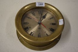 A reproduction brass cased nautical ships style clock