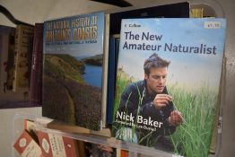 A carton of books with different genres about Science and Nature including 'The Natural History of