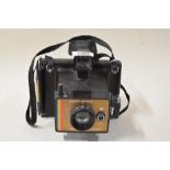 A Polaroid Colour Swinger Land Camera