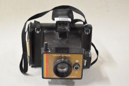 A Polaroid Colour Swinger Land Camera