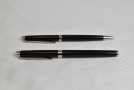 A Waterman Hemisphere Converter fill fountain pen and ballpoint pen set in black having Waterman