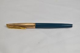 A Waterman CF converter fountain pen in teal with a rolled gold cap having 14ct nib. In very good