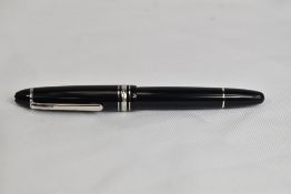 A Montblanc Meisterstuck 146 piston fill fountain pen in black with one broad and two narrow bands