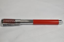 A Waterman made Harley Davidson converter fill fountain pen in red and steel, designed to look