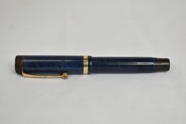 A Parker Duofold Jr Lucky Curve button fill fountain pen in lapis blue with single band to the cap