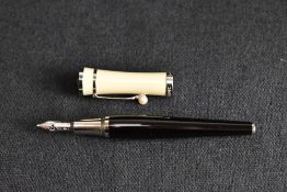 A Montblanc Greta Garbo cartridge fountain pen. This special edition pen with black barrel and cream