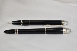 A Montblanc Starwalker converter fountain pen and ball point pen in black, having Montblanc 14ct