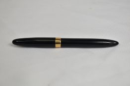A Sheaffer Statesman piston fill fountain pen in black with broad band to cap having Sheaffer 14k