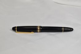 A Montblanc Meisterstuck 146 piston fill fountain pen in black with one broad and two narrow gold