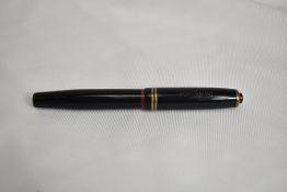 A Montblanc 246 piston fill fountain pen circa 1940, in black with two bands to the cap having