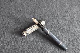 A Montblanc Writers Series Charles Dickens Limited Edition piston fill fountain pen. The barrel,