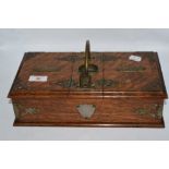 An Edwardian smokers table box, having brass mounts, carrying handle and two internal compartments.
