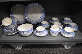 A late 19th century partial dinner service having blue floral transfer pattern on white ground, with