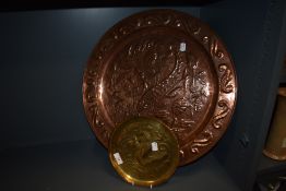 A large Keswick school of industrial arts copper charger with floral embossed design and scroll