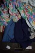 A box of ladies vintage and retro clothing, including bright 1980s blouse.