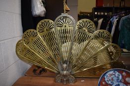 An early to mid 20th century brass fire guard, having folding action and oriental styling.