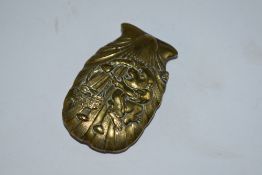 An early 20th century Japanese brass vesta case embossed monkey and basket.