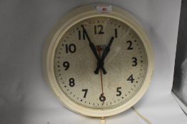 A mid century painted Bakelite Smiths factory/store clock.