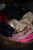 A mixed box of fabrics.