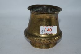 An Ankhora or ritual holy water pot of squat form in bronze or bronze effect metal, with rope like