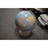 A globe on wooden base, 'Zoffoli, made in Italy'.