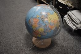 A globe on wooden base, 'Zoffoli, made in Italy'.