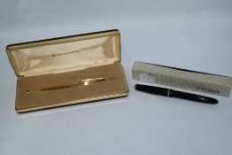 A boxed Parker Slimfold fountain pen and a boxed Parker gold ballpoint pen