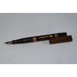A Waterman Ideal 52 lever fill fountain pen in BHR with two gold bands to barrel, damage to cap