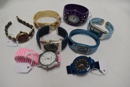 Eight ladies watches in a variety of styles and colours.