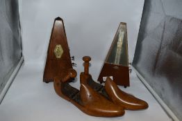 Two vintage wooden metronomes, one French with solid wood case, circa 1930s and the other German