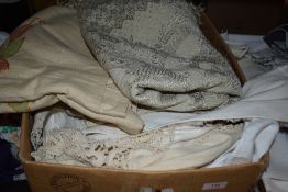 A large box of mixed vintage and retro table linen and similar.