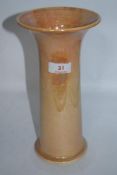 A 1923 dated Ruskin vase of fluted tubular shape, having peach lustre glaze.