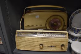 A mid century Bush radio and a Sanyo 6 transistor cordless radio.