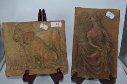 Two sculpted heavy stoneware tiles, one depicting lions and the other a traditionally dressed lady.