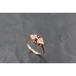 A garnet and seed pearl ring on a rose gold loop stamped 10K, size N & approx 2.7g