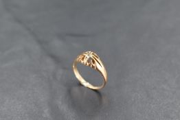 A yellow metal and diamond gypsy ring, the small diamond measuring 0.07cts approx, the shank with