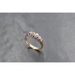 A five stone graduated old cut diamond ring, total approx 0.5ct in an open gallery mount on a yellow